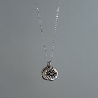 In motion silver Medallion